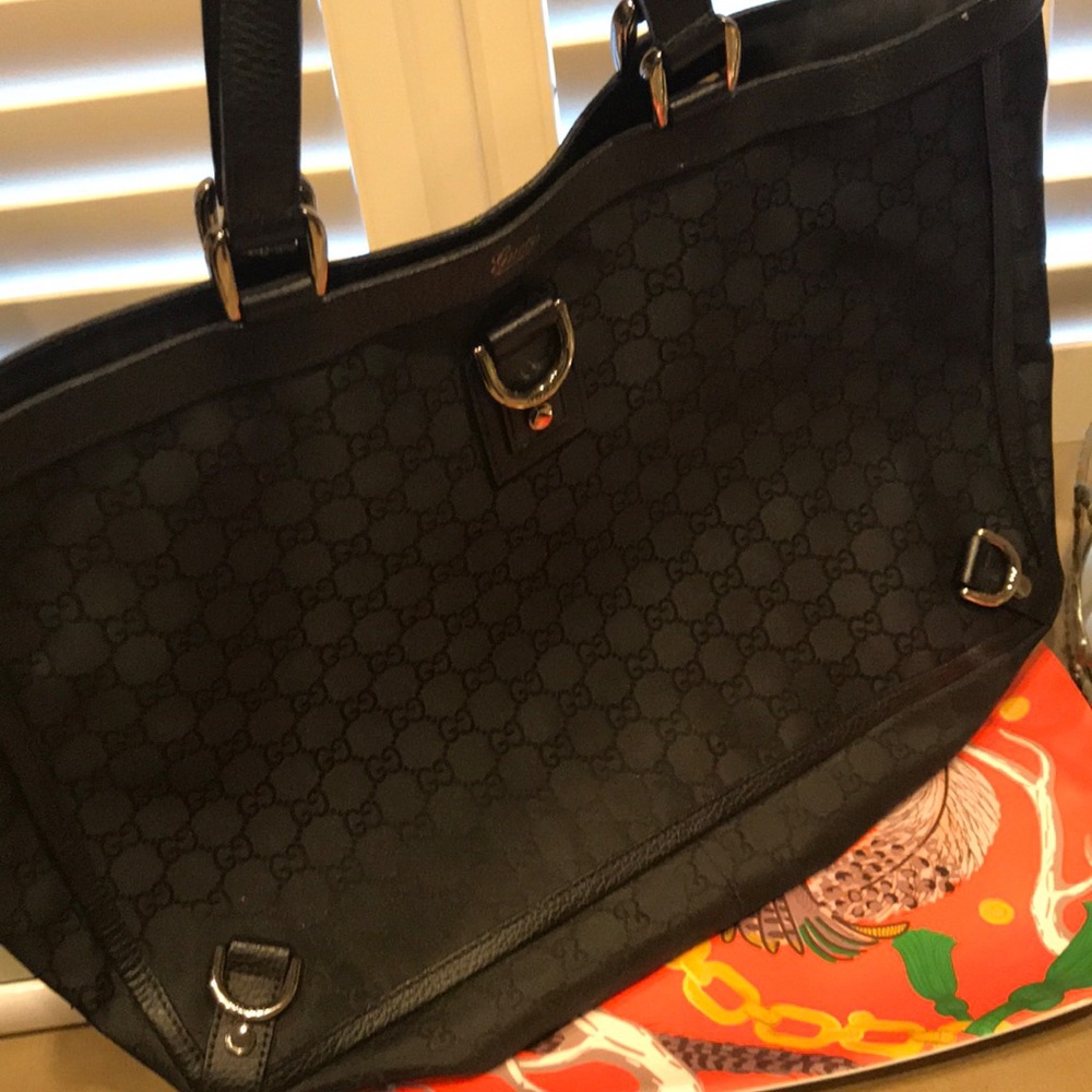 Black Gucci monogram tote bag.